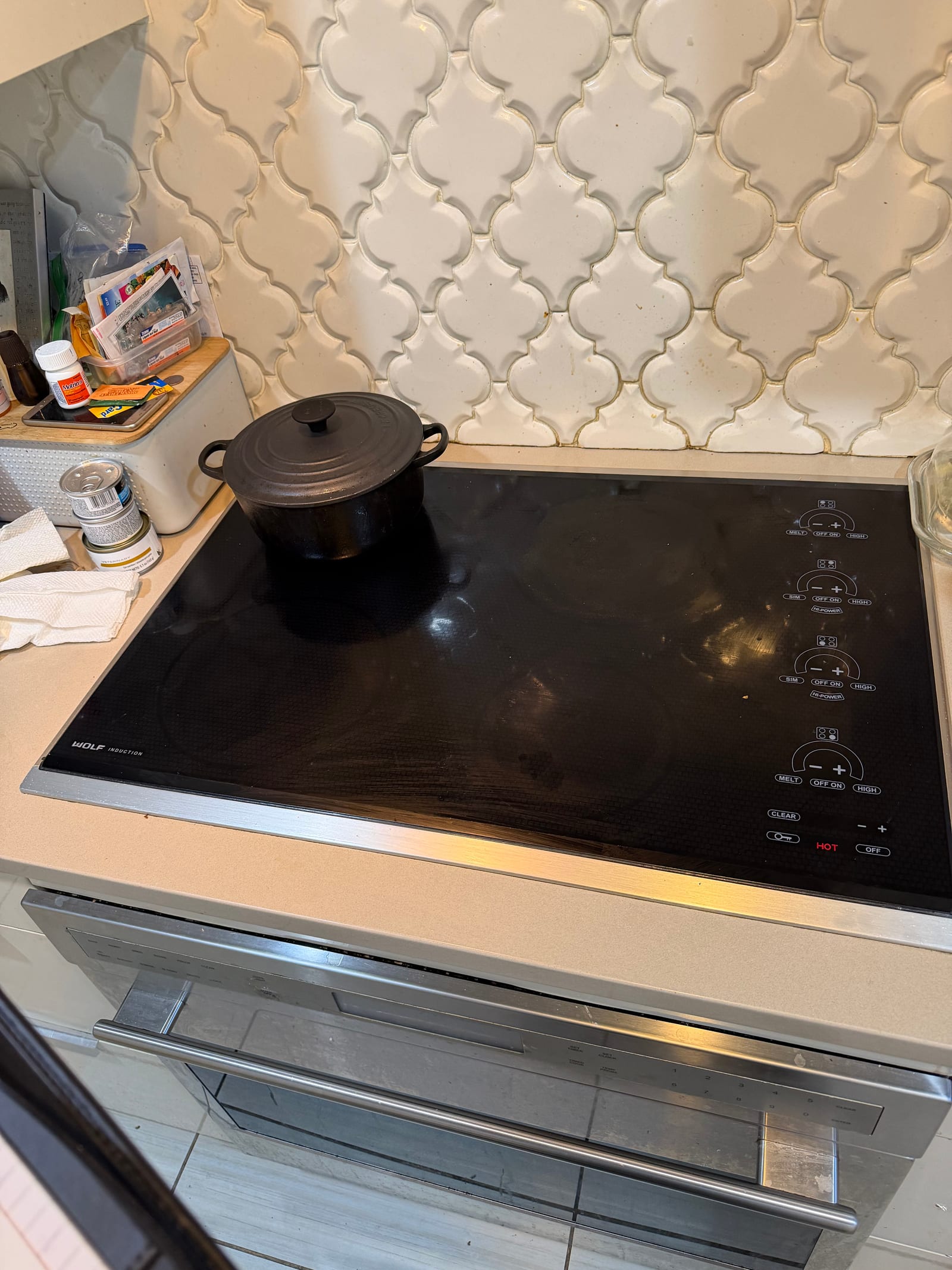 Wolf induction cooktop repair NYC Manhattan — black glass surface
